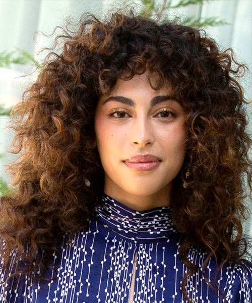 Mina El Hammani Long Curly    Brunette   Hairstyle with Side Swept Bangs  and Light Brunette Highlights